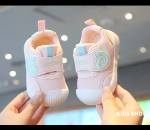 Close-up of pink breathable mesh baby walking shoes with soft soles and velcro strap