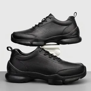 Men's black business casual leather shoes with breathable perforated design and thick sole