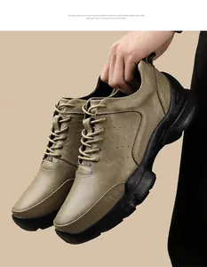 Detail of men's leather outdoor shoes with perforated sides and thick black sole