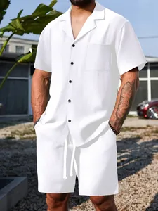 Detail view of men's white textured summer two-piece casual shirt and shorts set.