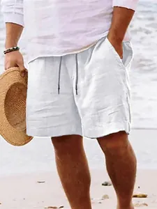 Detail view of men's casual white linen beach shorts featuring an adjustable drawstring waist.