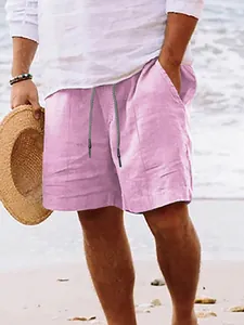 Detailed view of men's pink linen beach shorts featuring a drawstring waist and pockets
