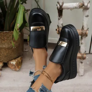 Stylish black platform loafers with gold metal detail and thick soles for height increase.