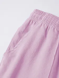 Detailed close-up of breathable linen fabric and waistband on men's summer beach shorts