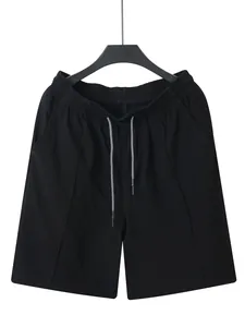 Detailed view of black men's linen cargo shorts with adjustable drawstring waist