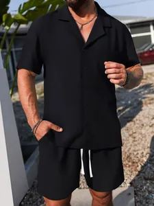 Close-up of men's black casual short sleeve shirt and shorts set with waffle texture.