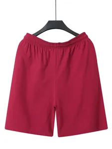 Macro detail of breathable red linen fabric on men's summer casual beach shorts