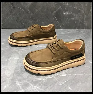 Detailed side view of men's brown leather loafers featuring thick cream wavy soles