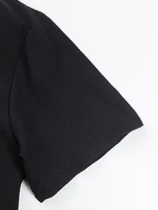 Macro view of the high-quality textured black fabric on a casual men's shirt sleeve