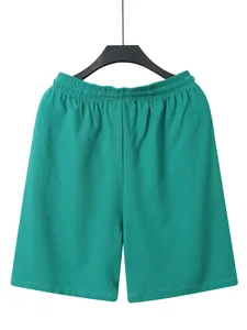 Close-up detail of teal men's casual linen shorts featuring a comfortable elastic waistband