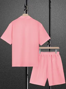 Detailed view of pink casual short-sleeve shirt and matching shorts set for men.