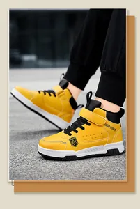Vibrant boys yellow high-top sneakers featuring waterproof leather for autumn outdoor activities