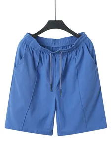 Detailed view of blue men's linen beach shorts with adjustable drawstring waist.