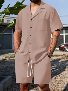 Macro view showing the textured waffle fabric and button detail of the men's casual summer set.