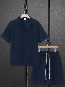 Men's casual navy blue short-sleeve shirt and drawstring shorts set with chest pocket