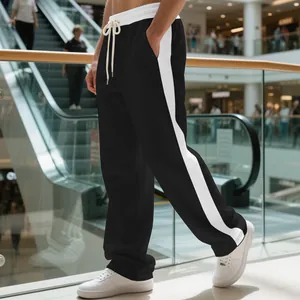 Close-up detail of heavyweight men's sweatpants with white side stripes and drawstring