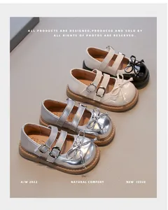 Detailed view of stylish girls' silver and beige Mary Jane leather shoes for autumn.