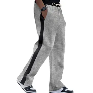 Side view of men's grey sweatpants with black contrast stripes and heavy terry fabric