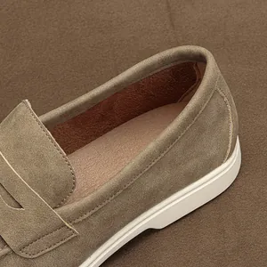 Macro detail of men's suede loafers showing premium stitching and soft lining texture