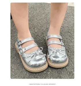 Sweet girl's silver metallic leather shoes with double buckle straps and bow detail