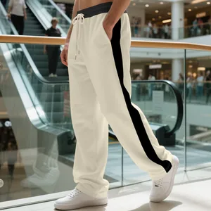 Men's heavy fleece sweatpants in cream with black side stripe, loose straight fit