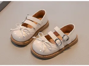 Elegant cream girls' Mary Jane shoes featuring stylish bows and double buckle straps