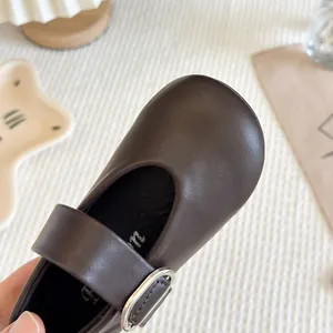 Classic brown Mary Jane leather shoes for girls featuring a stylish silver buckle strap