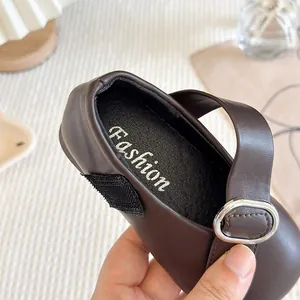 Stylish dark brown Mary Jane shoes for girls with buckle detail and soft leather texture