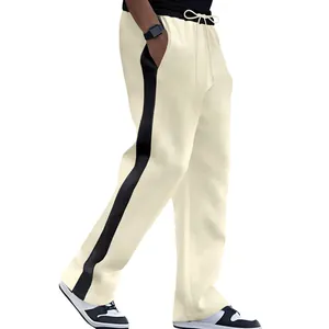 Side view of men's heavy terry sweatpants featuring a bold black contrast side stripe.