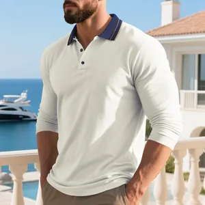 Macro detail of men's cream long-sleeved polo shirt featuring navy contrast collar