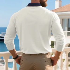 Back view of men's white long-sleeved pique polo shirt with navy contrast collar