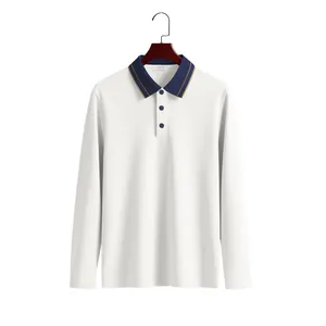 Detailed view of a white long-sleeved piqué polo shirt with a navy blue contrast collar