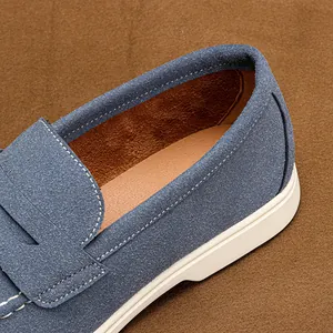 Detailed view of the premium blue suede texture and soft lining of men's slip-on loafers