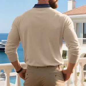 Back view of a premium beige long-sleeved piqué polo shirt for men in a coastal setting