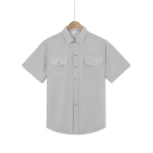 Detailed view of men's short-sleeved summer casual shirt in light grey with double pockets