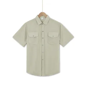 Detailed view of a light green short-sleeve casual shirt with double chest pockets.