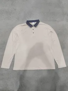 Men's long-sleeve polo shirt in beige featuring a navy contrast collar and striped detail
