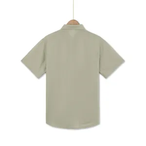 Detailed back view of men's loose casual short sleeve shirt in light sage green fabric
