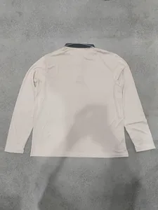 Back view of a beige long-sleeved business casual pique mesh polo shirt for men