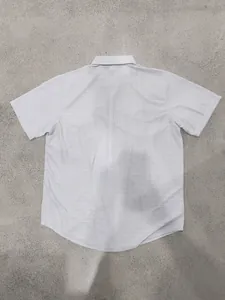Back view of a premium light grey checkered short sleeve casual shirt for men in summer