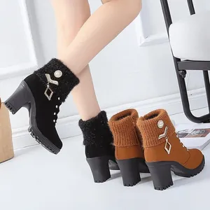 Detail view of rhinestone decorated ankle boots with knit cuffs and block heels