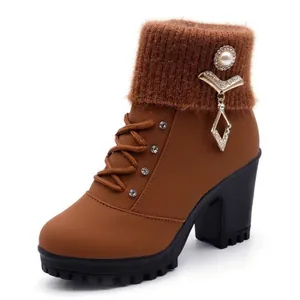 Stylish brown ankle boots with knit collar, block heel, and pearl rhinestone charm.