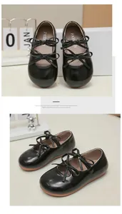 Detailed view of girls' black patent leather Mary Jane shoes with double bows.