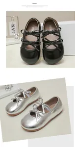 Close-up of girls' Mary Jane princess shoes in black and silver finishes with double bows