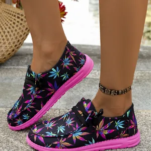 Comfortable women's canvas loafers with vibrant colorful leaf print and pink flat soles