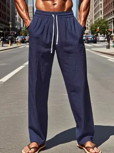 Casual men's navy blue cotton linen pants with drawstring waist for summer beach wear.