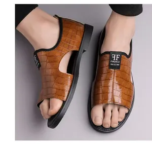 Detailed view of men's brown embossed leather Roman sandals with open-toe design