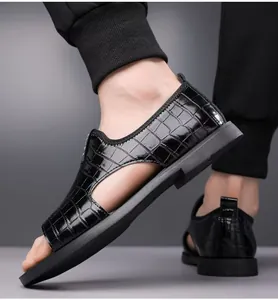Close-up of men's black embossed crocodile pattern Roman sandals with open-toe design.