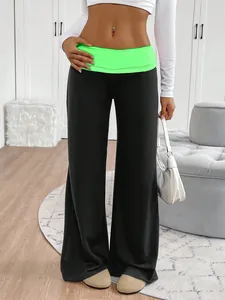 High-waist wide-leg yoga pants featuring a vibrant neon green fold-over waistband detail