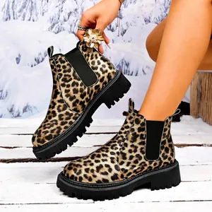 Fashionable leopard print Chelsea boots with thick black lug soles for winter season